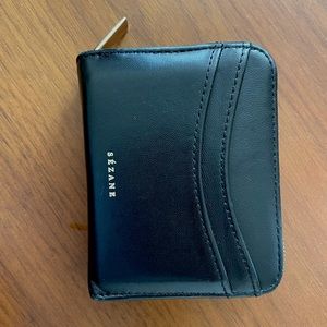 Sezane Black leather wallet with zip closure. Has exterior pockets on both sides